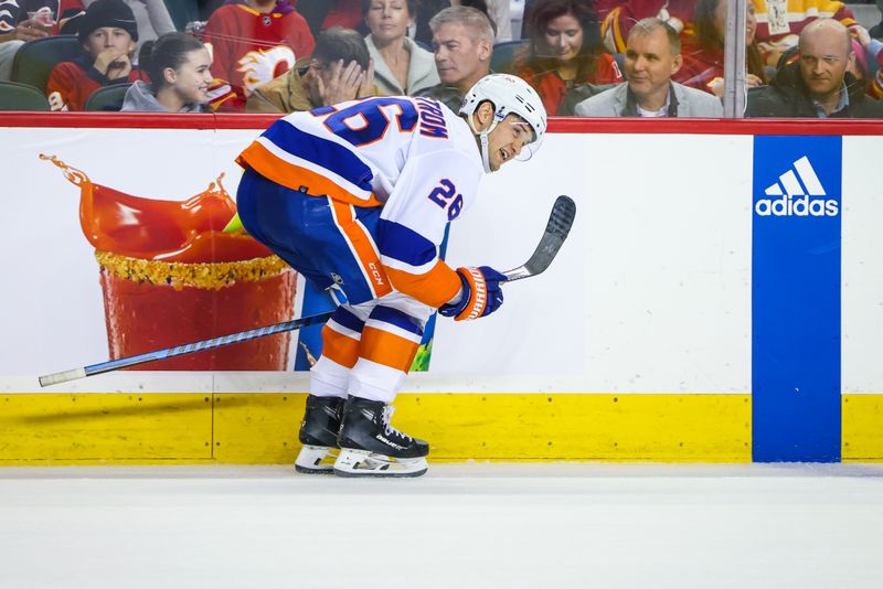 Nov 18, 2023; Calgary, Alberta, CAN; New York Islanders right wing Oliver Wahlstrom (26) celebrates his goal against the Calgary Flames during the shoot out period at Scotiabank Saddledome. Mandatory Credit: Sergei Belski-USA TODAY Sports