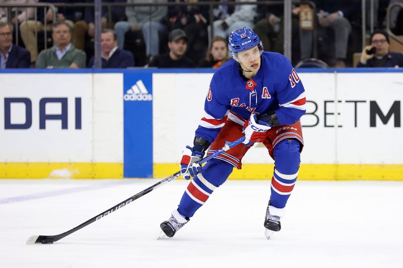 Feb 20, 2024; New York, New York, USA; New York Rangers left wing Artemi Panarin (10) brings the puck up ice against the Dallas Stars during the first period at Madison Square Garden. Mandatory Credit: Brad Penner-USA TODAY Sports