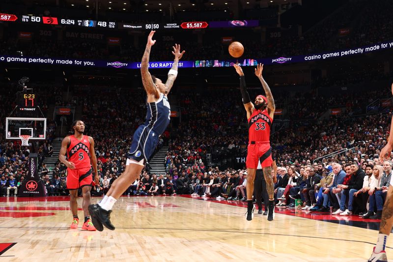 TORONTO, CANADA - FEBRUARY 28: Gary Trent Jr. #33 of the Toronto Raptors shoots the ball during the game against the Dallas Mavericks on February 28, 2024 at the Scotiabank Arena in Toronto, Ontario, Canada.  NOTE TO USER: User expressly acknowledges and agrees that, by downloading and or using this Photograph, user is consenting to the terms and conditions of the Getty Images License Agreement.  Mandatory Copyright Notice: Copyright 2024 NBAE (Photo by Vaughn Ridley/NBAE via Getty Images)