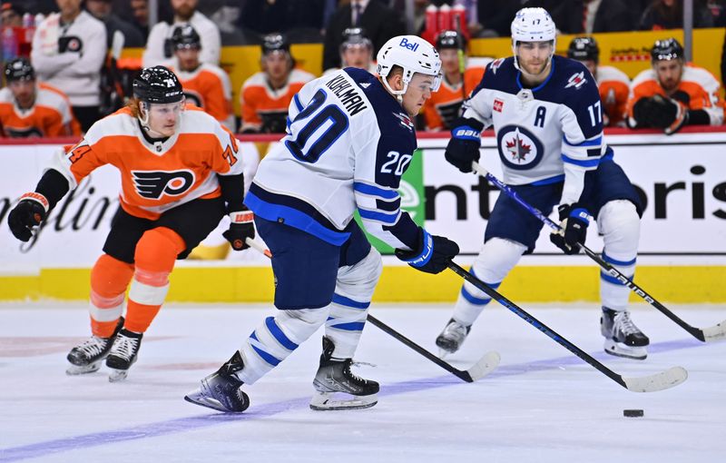 Jan 22, 2023; Philadelphia, Pennsylvania, USA; Winnipeg Jets center Karson Kuhlman (20) controls the puck against the Philadelphia Flyers in the first period at Wells Fargo Center. Mandatory Credit: Kyle Ross-USA TODAY Sports