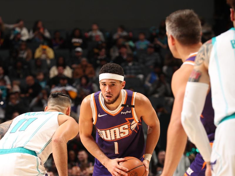 CHARLOTTE, NC - JANUARY 7: Devin Booker #1 of the Phoenix Suns handles the ball during the game against the Charlotte Hornets on January 7, 2025 at Spectrum Center in Charlotte, North Carolina. NOTE TO USER: User expressly acknowledges and agrees that, by downloading and or using this photograph, User is consenting to the terms and conditions of the Getty Images License Agreement. Mandatory Copyright Notice: Copyright 2025 NBAE (Photo by Kent Smith/NBAE via Getty Images)