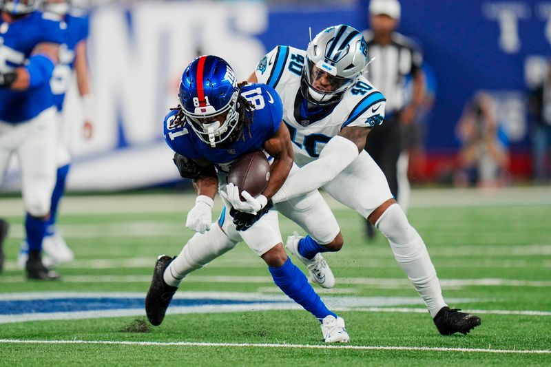 New York Giants wide receiver Kalil Pimpleton (81) is tackled by Carolina Panthers linebacker Brandon Smith (40) during an NFL pre-season football game on Friday, Aug. 18, 2023, in East Rutherford, N.J. (AP Photo/Rusty Jones)