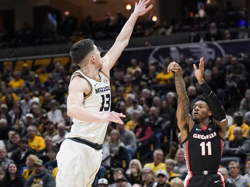 Jan 6, 2024; Columbia, Missouri, USA; Georgia Bulldogs guard Justin Hill (11) shoots as Missouri Tigers forward Jesus Carralero Martin (13) defends during the second half at Mizzou Arena. Mandatory Credit: Denny Medley-USA TODAY Sports