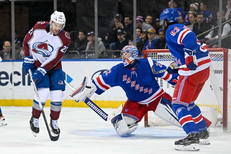 Feb 5, 2024; New York, New York, USA;  Colorado Avalanche left wing Jonathan Drouin (27) deflects the puck in front of New York Rangers goaltender Jonathan Quick (32) during the second period at Madison Square Garden. Mandatory Credit: Dennis Schneidler-USA TODAY Sports