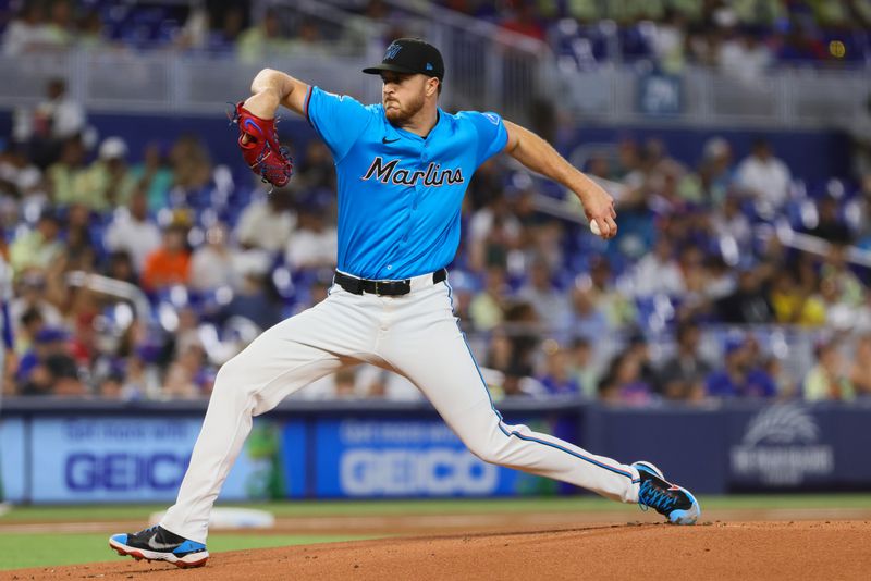 Jul 21, 2024; Miami, Florida, USA; Miami Marlins starting pitcher Trevor Rogers (28) delivers a pitch against the New York Mets during the first inning at loanDepot Park. Mandatory Credit: Sam Navarro-USA TODAY Sports