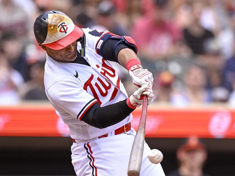 Jul 8, 2023; Minneapolis, Minnesota, USA; Minnesota Twins infielder Donovan Solano (39) hits an RBI double against the Baltimore Orioles during the sixth inning at Target Field. Mandatory Credit: Nick Wosika-USA TODAY Sports