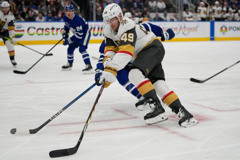 Nov 20, 2024; Toronto, Ontario, CAN; Vegas Golden Knights forward Ivan Barbashev (49) carries the puck against the Toronto Maple Leafs during the second period at Scotiabank Arena. Mandatory Credit: John E. Sokolowski-Imagn Images