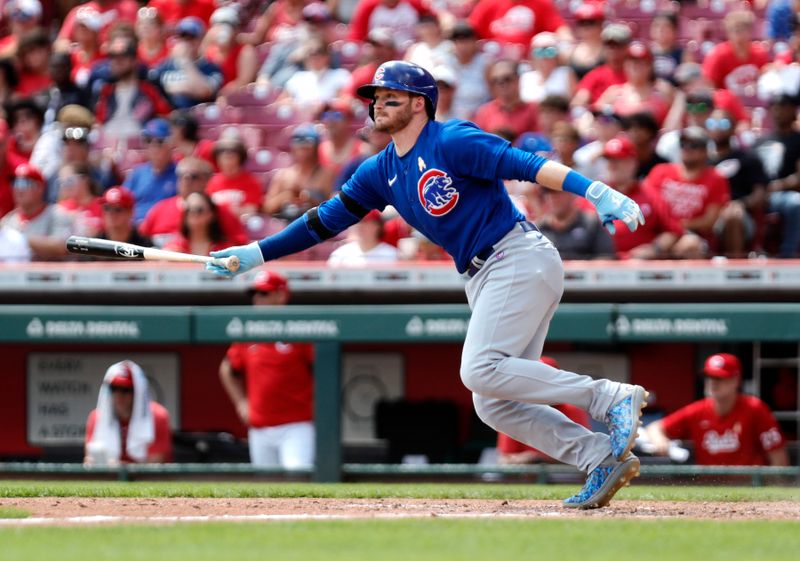 Sep 3, 2023; Cincinnati, Ohio, USA; Chicago Cubs left fielder Ian Happ (8) hits an RBI single against the Cincinnati Reds during the seventh inning at Great American Ball Park. Mandatory Credit: David Kohl-USA TODAY Sports