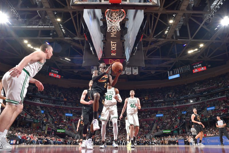 CLEVELAND, OH - MARCH 5: Caris LeVert #3 of the Cleveland Cavaliers drives to the basket during the game against the Boston Celtics on March 5, 2024 at Rocket Mortgage FieldHouse in Cleveland, Ohio. NOTE TO USER: User expressly acknowledges and agrees that, by downloading and/or using this Photograph, user is consenting to the terms and conditions of the Getty Images License Agreement. Mandatory Copyright Notice: Copyright 2024 NBAE (Photo by David Liam Kyle/NBAE via Getty Images)