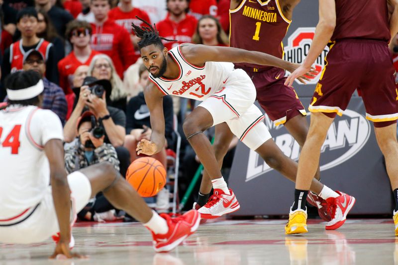 Dec 3, 2023; Columbus, Ohio, USA;  Ohio State Buckeyes guard Evan Mahaffey (12) reaches for the loose ball during the first half against the Minnesota Golden Gophers at Value City Arena. Mandatory Credit: Joseph Maiorana-USA TODAY Sports