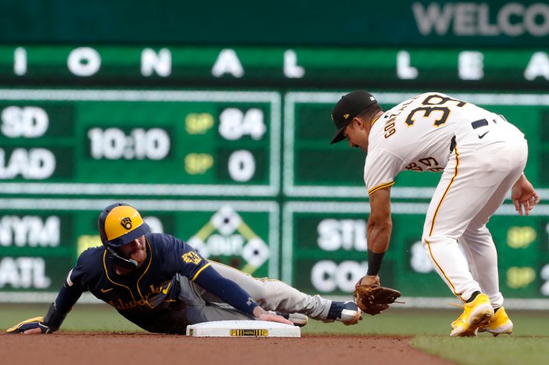 Sep 25, 2024; Pittsburgh, Pennsylvania, USA;  Milwaukee Brewers second baseman Brice Turang (2) steals second base as Pittsburgh Pirates second baseman Nick Gonzales (39) applies a late tag during the first inning at PNC Park. Mandatory Credit: Charles LeClaire-Imagn Images