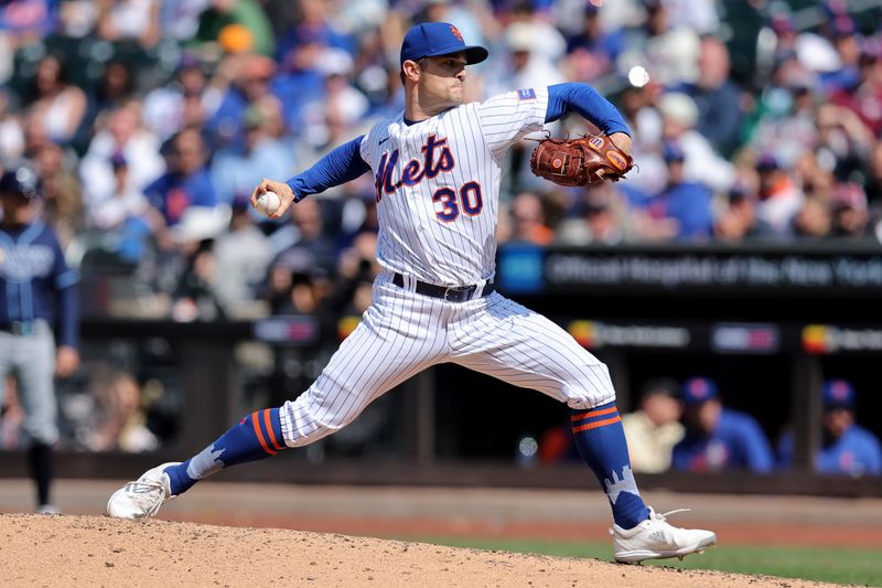 May 18, 2023; New York City, New York, USA; New York Mets relief pitcher David Robertson (30) pitches against the Tampa Bay Rays during the ninth inning at Citi Field. Mandatory Credit: Brad Penner-USA TODAY Sports