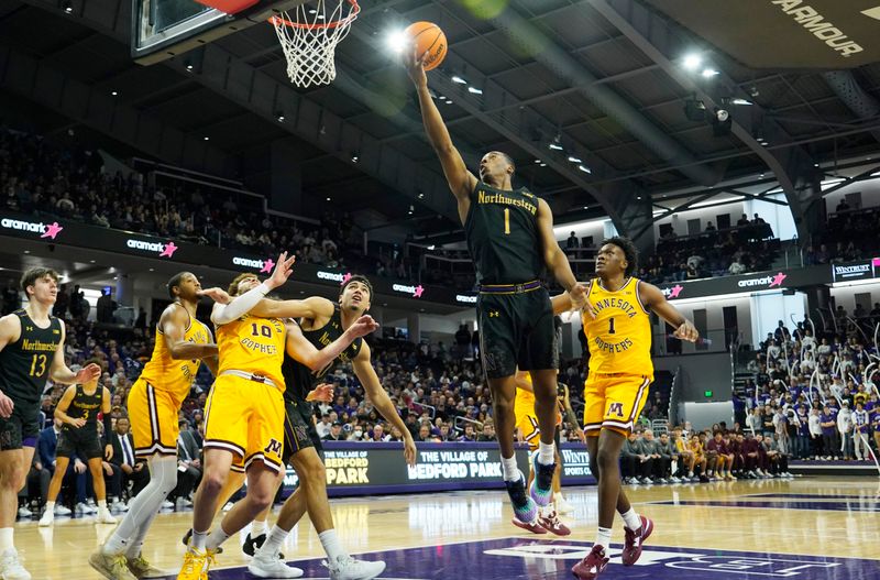 Jan 28, 2023; Evanston, Illinois, USA; Northwestern Wildcats guard Chase Audige (1) scores as on Minnesota Golden Gophers forward Joshua Ola-Joseph (1) during the second half at Welsh-Ryan Arena. Mandatory Credit: David Banks-USA TODAY Sports