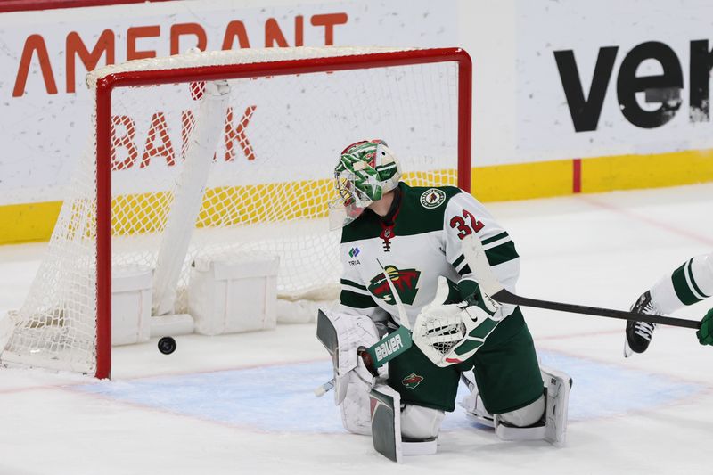 Jan 19, 2024; Sunrise, Florida, USA; Minnesota Wild goaltender Filip Gustavsson (32) watches the puck go into the net after a shot by Florida Panthers defenseman Gustav Forsling (not pictured) during the third period at Amerant Bank Arena. Mandatory Credit: Sam Navarro-USA TODAY Sports