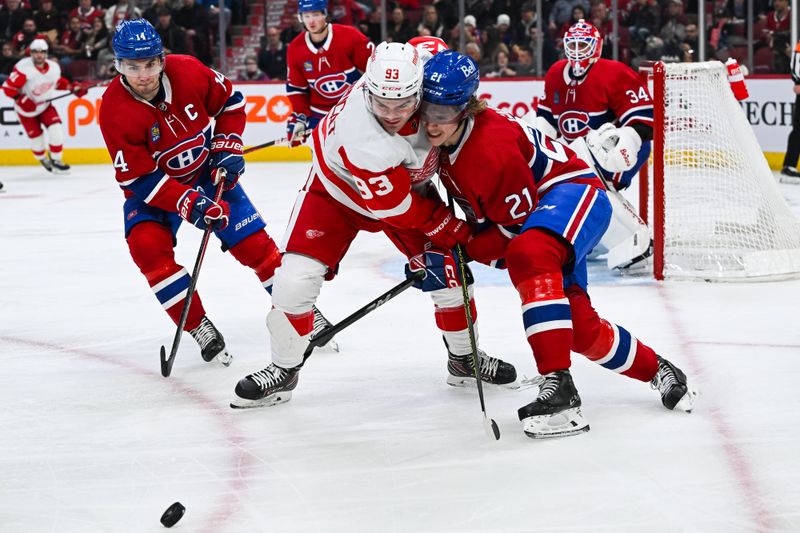 Dec 2, 2023; Montreal, Quebec, CAN; Montreal Canadiens defenseman Kaiden Guhle (21) defends the puck against Detroit Red Wings right wing Alex DeBrincat (93) during the second period at Bell Centre. Mandatory Credit: David Kirouac-USA TODAY Sports