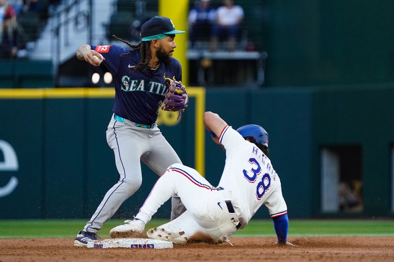 May 3, 2025; Arlington, Texas, USA; Texas Rangers outfielder Dustin Harris (38) is forced out at second base by Seattle Mariners shortstop J.P. Crawford (3) at Globe Life Field. Mandatory Credit: Raymond Carlin III-Imagn Images