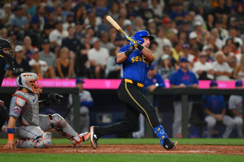 Aug 9, 2024; Seattle, Washington, USA; Seattle Mariners catcher Cal Raleigh (29) hits a 2-RBI single against the New York Mets during the seventh inning at T-Mobile Park. Mandatory Credit: Steven Bisig-USA TODAY Sports