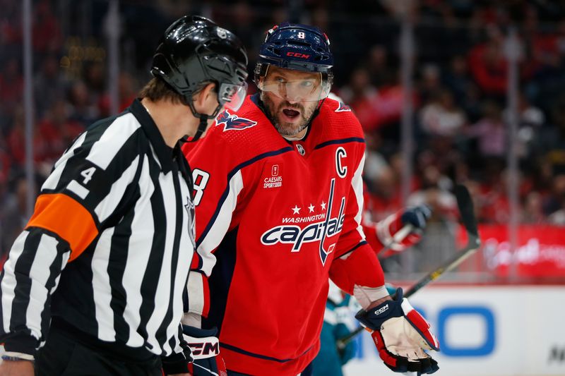 Oct 29, 2023; Washington, District of Columbia, USA; Washington Capitals left wing Alex Ovechkin (8) questions a call with referee Wes McCauley (4) during the first period against the San Jose Sharks at Capital One Arena. Mandatory Credit: Amber Searls-USA TODAY Sports