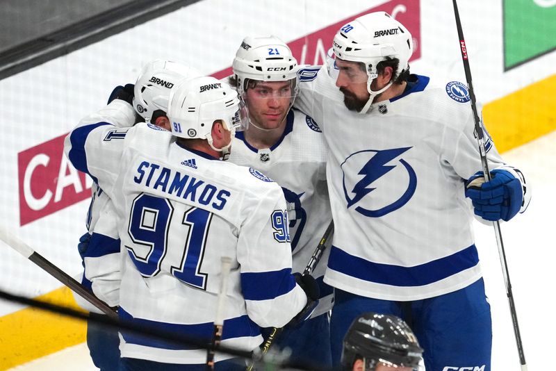 Mar 19, 2024; Las Vegas, Nevada, USA; Tampa Bay Lightning center Brayden Point (21) celebrates with team mates after scoring a goal against the Vegas Golden Knights during the third period at T-Mobile Arena. Mandatory Credit: Stephen R. Sylvanie-USA TODAY Sports