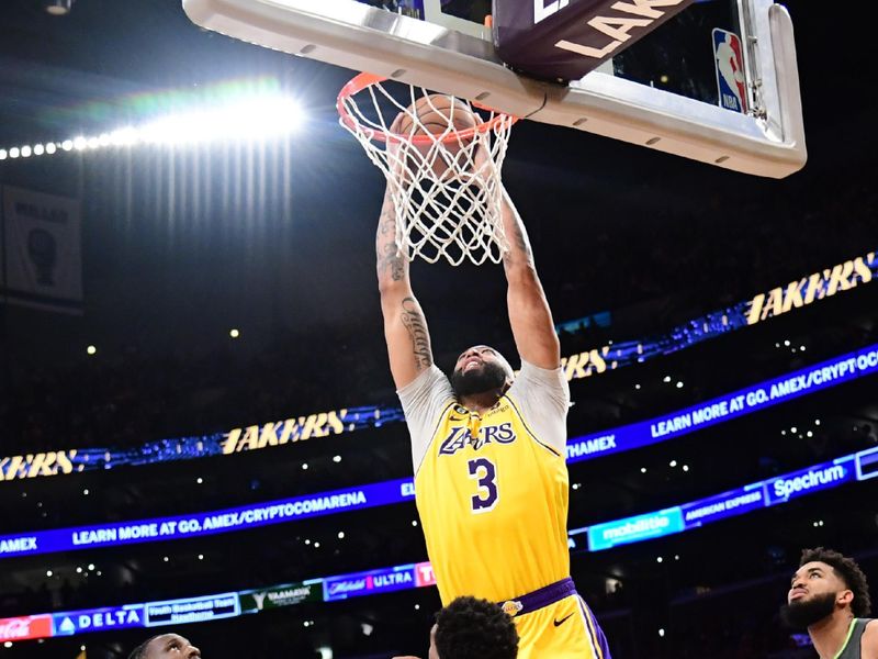 LOS ANGELES, CA - APRIL 11: Anthony Davis #3 of the Los Angeles Lakers dunks the ball during the game against the Minnesota Timberwolves during the 2023 Play-In Tournament on April 11, 2023 at Crypto.Com Arena in Los Angeles, California. NOTE TO USER: User expressly acknowledges and agrees that, by downloading and/or using this Photograph, user is consenting to the terms and conditions of the Getty Images License Agreement. Mandatory Copyright Notice: Copyright 2023 NBAE (Photo by Adam Pantozzi/NBAE via Getty Images)