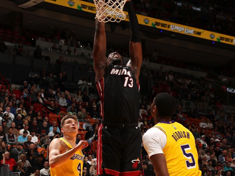 MIAMI, FL - DECEMBER 4: Bam Adebayo #13 of the Miami Heat dunks the ball during the game against the Los Angeles Lakers on December 4, 2024 at Kaseya Center in Miami, Florida. NOTE TO USER: User expressly acknowledges and agrees that, by downloading and or using this Photograph, user is consenting to the terms and conditions of the Getty Images License Agreement. Mandatory Copyright Notice: Copyright 2024 NBAE (Photo by Issac Baldizon/NBAE via Getty Images)