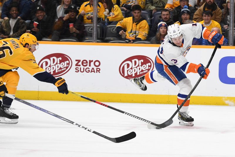 Jan 13, 2024; Nashville, Tennessee, USA; New York Islanders center Mathew Barzal (13) shoots the puck during the second period against the Nashville Predators at Bridgestone Arena. Mandatory Credit: Christopher Hanewinckel-USA TODAY Sports