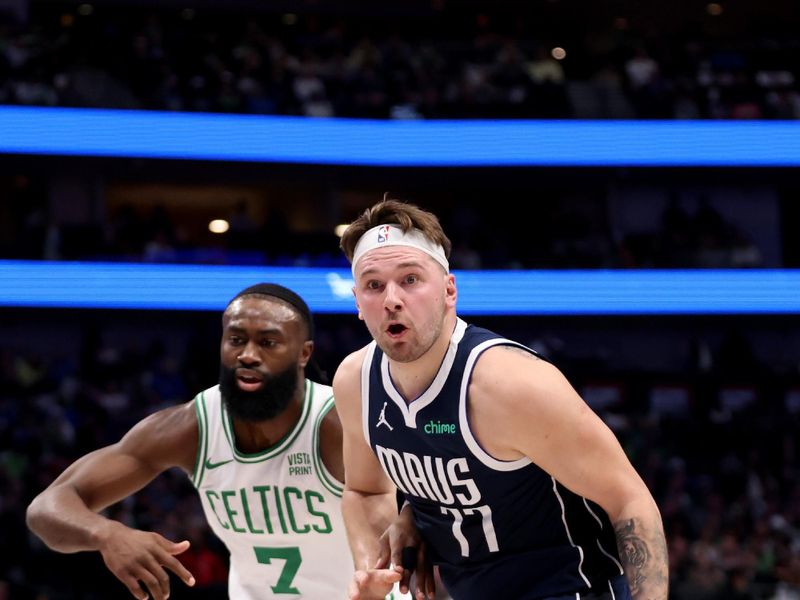 DALLAS, TEXAS - JANUARY 22: Luka Doncic #77 of the Dallas Mavericks goes to the basket against Jaylen Brown #7 of the Boston Celtics in the first half at American Airlines Center on January 22, 2024 in Dallas, Texas. NOTE TO USER: User expressly acknowledges and agrees that, by downloading and or using this photograph, User is consenting to the terms and conditions of the Getty Images License Agreement. (Photo by Tim Heitman/Getty Images)