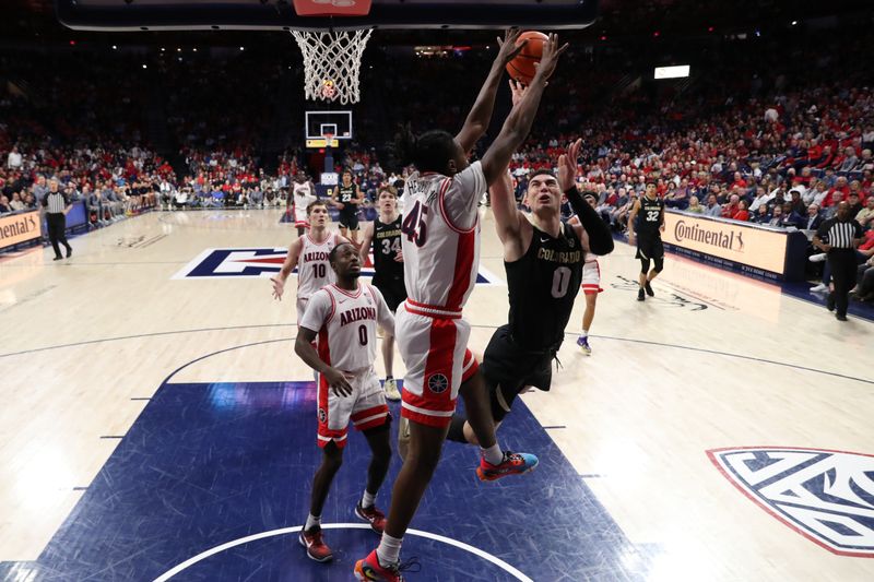 Feb 18, 2023; Tucson, Arizona, USA; Arizona Wildcats guard Cedric Henderson Jr. (45) gets a block against Colorado Buffaloes guard Luke O'Brien (0) during the second half at McKale Center. Mandatory Credit: Zachary BonDurant-USA TODAY Sports