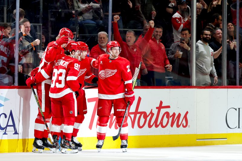 Apr 7, 2024; Detroit, Michigan, USA; Detroit Red Wings right wing Patrick Kane (88) receives congratulations from teammates after scoring in the first period against the Buffalo Sabres at Little Caesars Arena. Mandatory Credit: Rick Osentoski-USA TODAY Sports