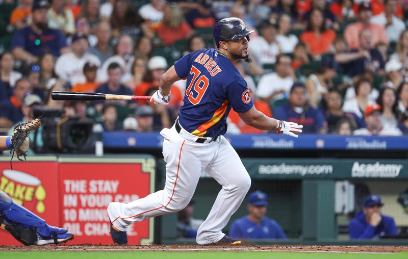 Sep 24, 2023; Houston, Texas, USA; Houston Astros first baseman Jose Abreu (79) hits an RBI double during the first inning against the Kansas City Royals at Minute Maid Park. Mandatory Credit: Troy Taormina-USA TODAY Sports