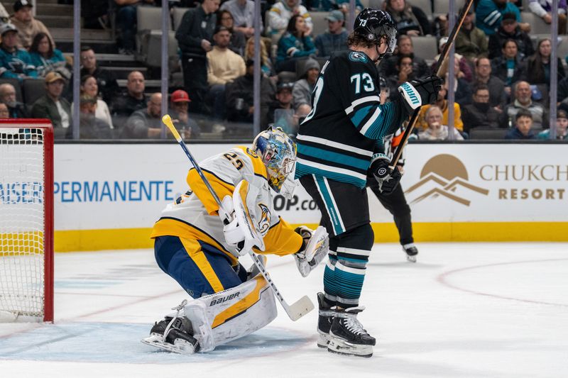 Jan 23, 2025; San Jose, California, USA;  Nashville Predators goaltender Justus Annunen (29) makes a save with San Jose Sharks center Tyler Toffoli (73) blocking his view during the second period at SAP Center at San Jose. Mandatory Credit: Neville E. Guard-Imagn Images