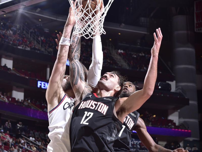 HOUSTON, TX - NOVEMBER 15: Steven Adams #12 of the Houston Rockets drives to the basket during the game against the LA Clippers during the Emirates NBA Cup game on November 15, 2024 at the Toyota Center in Houston, Texas. NOTE TO USER: User expressly acknowledges and agrees that, by downloading and or using this photograph, User is consenting to the terms and conditions of the Getty Images License Agreement. Mandatory Copyright Notice: Copyright 2024 NBAE (Photo by Logan Riely/NBAE via Getty Images)