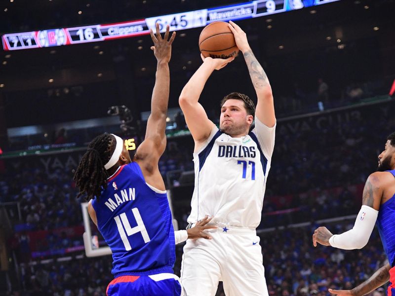 LOS ANGELES, CA - APRIL 21:  Luka Doncic #77 of the Dallas Mavericks shoots the ball during the game against the LA Clippers during Round 1 Game 1 of the 2024 NBA Playoffs on April 21, 2024 at Crypto.Com Arena in Los Angeles, California. NOTE TO USER: User expressly acknowledges and agrees that, by downloading and/or using this Photograph, user is consenting to the terms and conditions of the Getty Images License Agreement. Mandatory Copyright Notice: Copyright 2024 NBAE (Photo by Adam Pantozzi/NBAE via Getty Images)