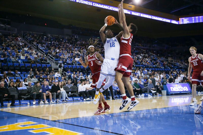 Jan 3, 2024; Los Angeles, California, USA; UCLA guard Sebastian Mack (12) drives the ball as Stanford Cardinal forward Brandon Angel (23) and Stanford Cardinal guard Kanaan Carlyle (3) defend during the second half at Pauley Pavilion presented by Wescom. Mandatory Credit: Yannick Peterhans-USA TODAY Sports