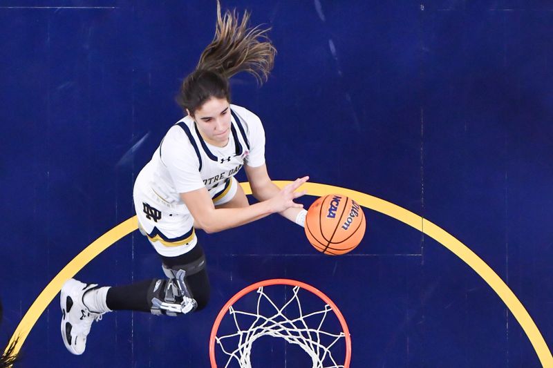 Jan 14, 2024; South Bend, Indiana, USA; Notre Dame Fighting Irish guard Sonia Citron (11) goes up for a shot in the first half against the Miami Hurricanes at the Purcell Pavilion. Mandatory Credit: Matt Cashore-USA TODAY Sports