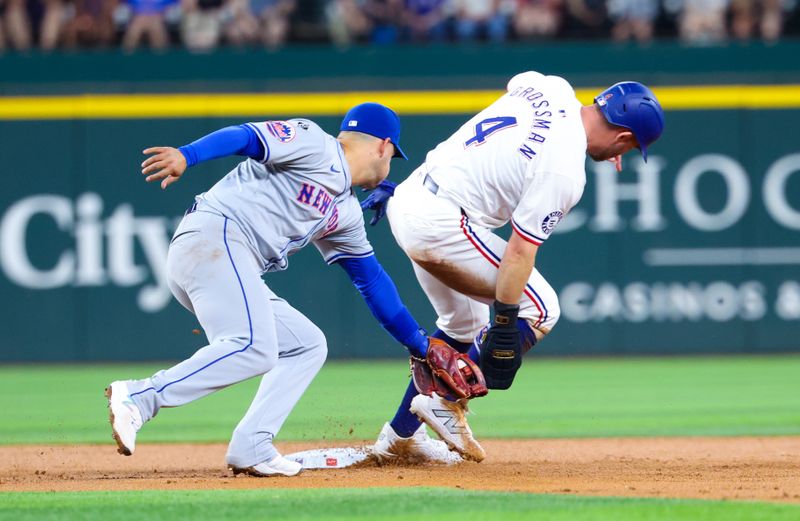 Jun 19, 2024; Arlington, Texas, USA; Texas Rangers left fielder Robbie Grossman (4) steals second base ahead of the tag by New York Mets second baseman Jose Iglesias (11) during the first inning at Globe Life Field. Mandatory Credit: Kevin Jairaj-USA TODAY Sports