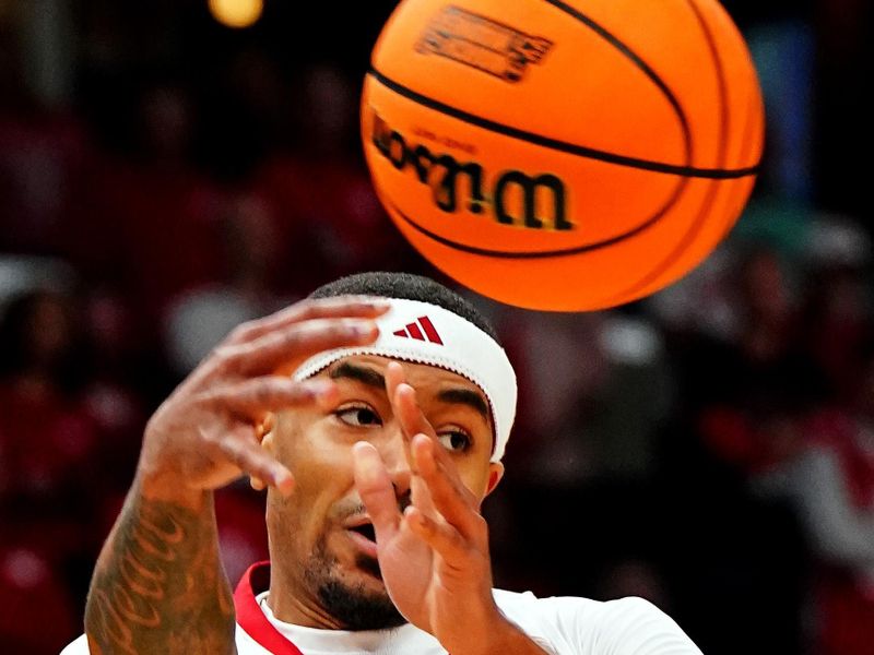 Mar 22, 2024; Memphis, TN, USA;  Nebraska Cornhuskers guard Jamarques Lawrence (10) passes the bal; during the first half of the game against the Texas A&M Aggies in the first round of the 2024 NCAA Tournament at FedExForum. Mandatory Credit: John David Mercer-USA TODAY Sports