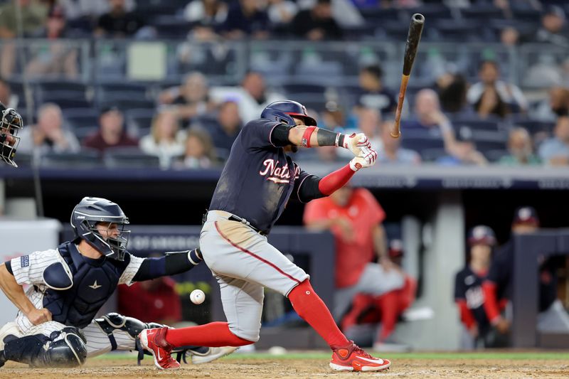 Aug 22, 2023; Bronx, New York, USA; Washington Nationals second baseman Ildemaro Vargas (14) loses his bat on a swing during the ninth inning against the New York Yankees at Yankee Stadium. Mandatory Credit: Brad Penner-USA TODAY Sports