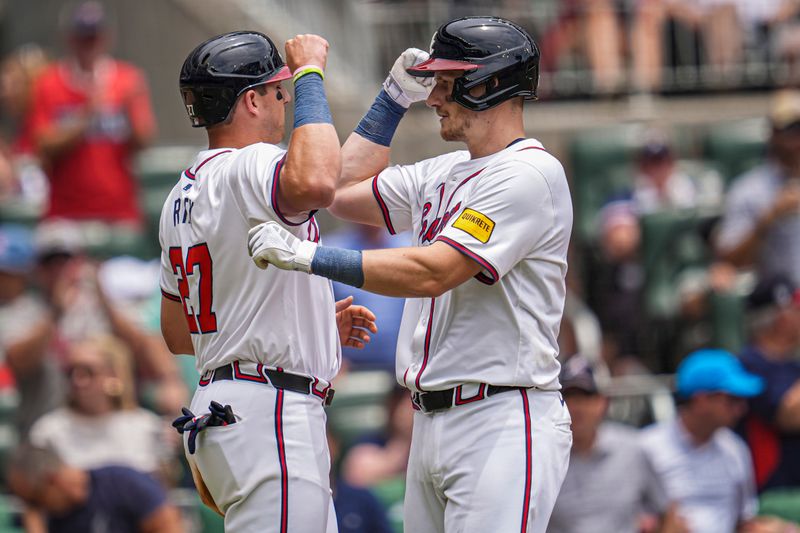 Jun 19, 2024; Cumberland, Georgia, USA; Atlanta Braves catcher Sean Murphy (right) reacts with third baseman Austin Riley (27) after hitting a two run home run against the Detroit Tigers during the third inning at Truist Park. Mandatory Credit: Dale Zanine-USA TODAY Sports