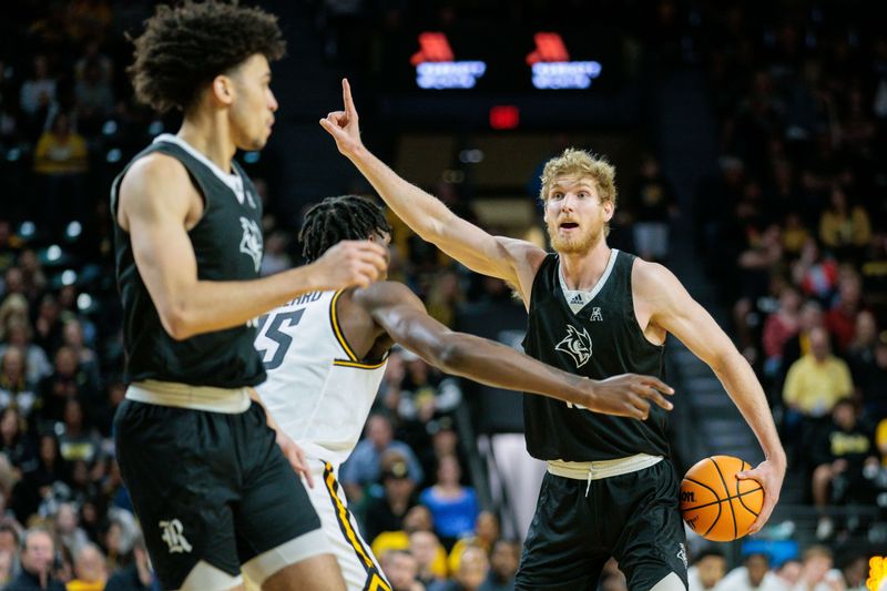 Mar 2, 2024; Wichita, Kansas, USA; Rice Owls forward Max Fiedler (15) sets the play during the second half against the Wichita State Shockers at Charles Koch Arena. Mandatory Credit: William Purnell-USA TODAY Sports