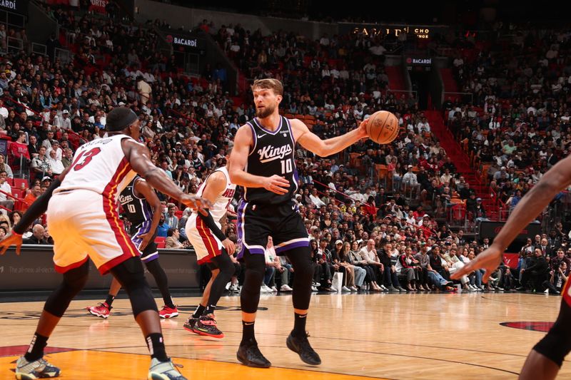 MIAMI, FL - JANUARY 31: Domantas Sabonis #10 of the Sacramento Kings handles the ball during the game against the Miami Heat on January 31, 2024 at Kaseya Center in Miami, Florida. NOTE TO USER: User expressly acknowledges and agrees that, by downloading and or using this Photograph, user is consenting to the terms and conditions of the Getty Images License Agreement. Mandatory Copyright Notice: Copyright 2024 NBAE (Photo by Issac Baldizon/NBAE via Getty Images)