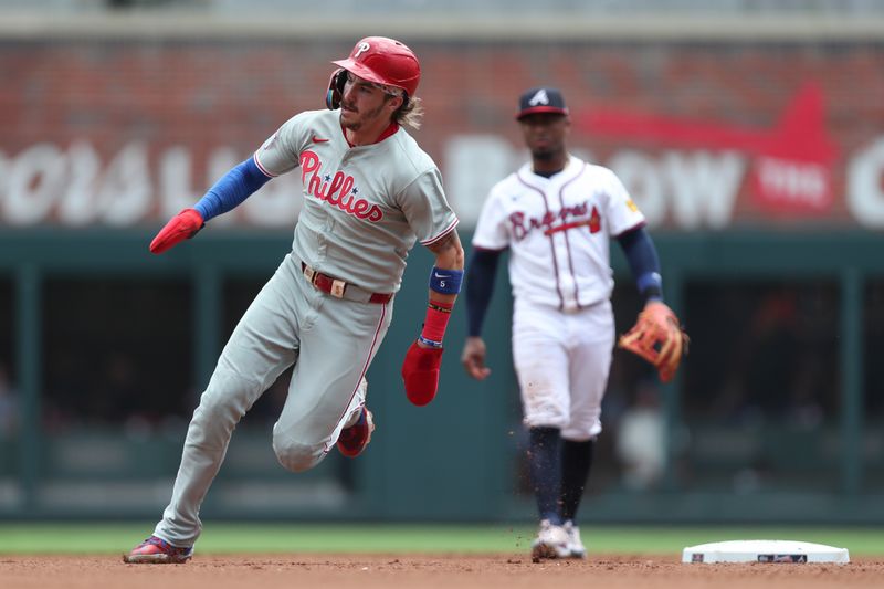 Jun 29, 2025; Cumberland, Georgia, Philadelphia Phillies second baseman Bryson Stott (5) rounds second base during a game against the Atlanta Braves during the fifth inning at Truist Park. Mandatory Credit: Mady Mertens-Imagn Images