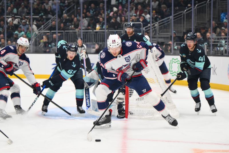 Nov 11, 2025; Seattle, Washington, USA; Columbus Blue Jackets right wing Mathieu Olivier (24) plays the puck during the first period against the Seattle Kraken at Climate Pledge Arena. Mandatory Credit: Steven Bisig-Imagn Images