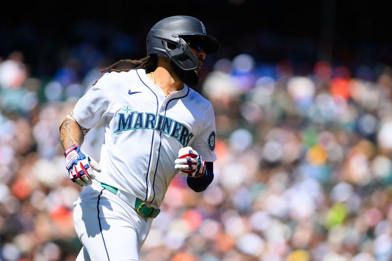 Jul 4, 2024; Seattle, Washington, USA; Seattle Mariners shortstop J.P. Crawford (3) runs towards first base after hitting a single against the Baltimore Orioles during the first inning at T-Mobile Park. Mandatory Credit: Steven Bisig-USA TODAY Sports
