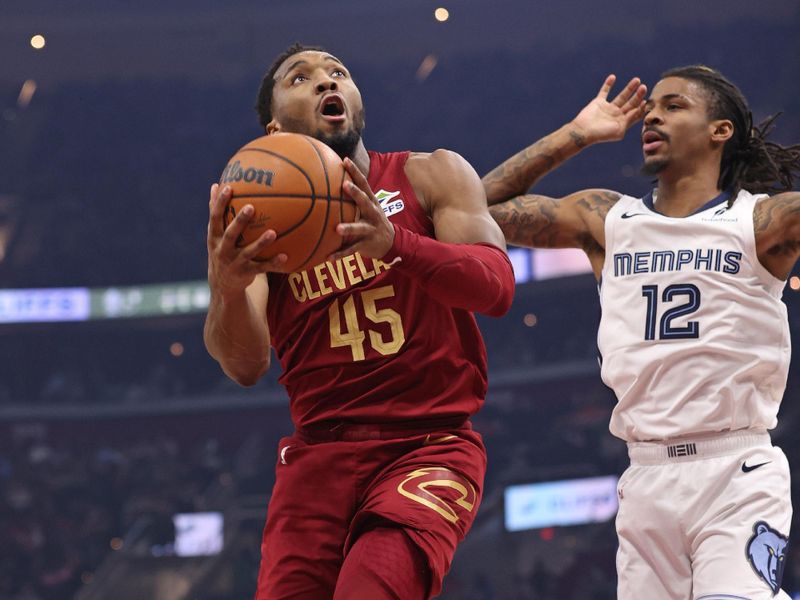 CLEVELAND, OH - FEBRUARY 23: Donovan Mitchell #45 of the Cleveland Cavaliers drives to the basket during the game against the Memphis Grizzlies on February 23, 2025 at Rocket Arena in Cleveland, Ohio. NOTE TO USER: User expressly acknowledges and agrees that, by downloading and/or using this Photograph, user is consenting to the terms and conditions of the Getty Images License Agreement. Mandatory Copyright Notice: Copyright 2025 NBAE (Photo by Joe Murphy/NBAE via Getty Images)