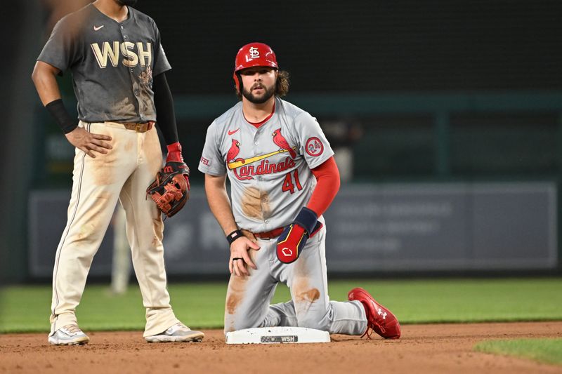 Jul 5, 2024; Washington, District of Columbia, USA; St. Louis Cardinals right fielder Alec Burleson (41) looks towards the dugout after sliding into second base against the Washington Nationals during the seventh inning at Nationals Park. Mandatory Credit: Rafael Suanes-USA TODAY Sports