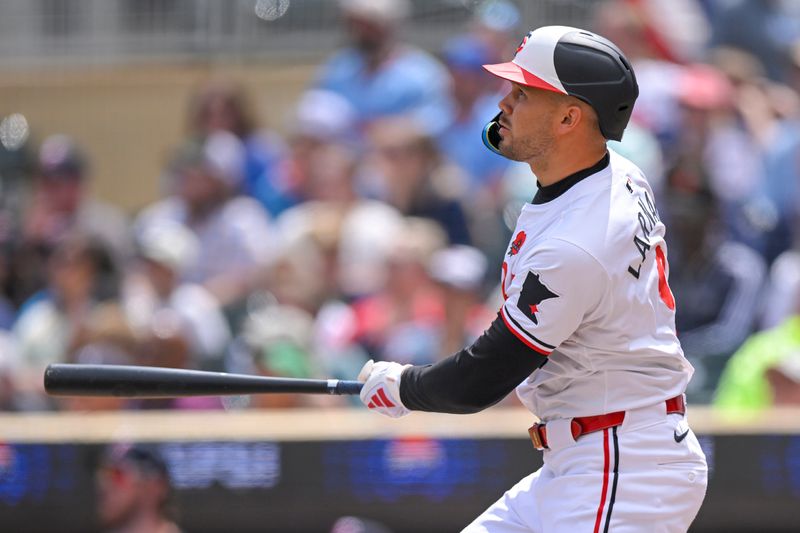 May 27, 2024; Minneapolis, Minnesota, USA; Minnesota Twins designated hitter Trevor Larnach (9) hits a three-run home run against the Kansas City Royals during the fifth inning at Target Field. Mandatory Credit: Nick Wosika-USA TODAY Sports