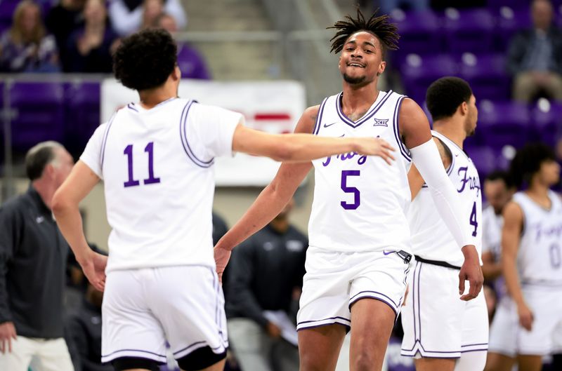 Feb 12, 2024; Fort Worth, Texas, USA;  TCU Horned Frogs forward Chuck O'Bannon Jr. (5) celebrates with TCU Horned Frogs guard Trevian Tennyson (11) during the second half against the West Virginia Mountaineers at Ed and Rae Schollmaier Arena. Mandatory Credit: Kevin Jairaj-USA TODAY Sports