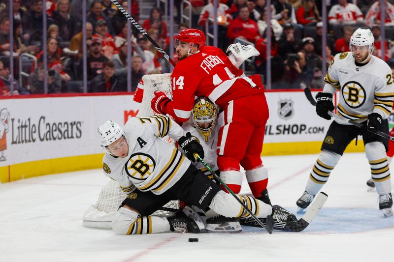 Dec 31, 2023; Detroit, Michigan, USA; Boston Bruins defenseman Charlie McAvoy (73) attempts to gain control of the puck during the second period of the game between the Boston Bruins and the Detroit Red Wings at Little Caesars Arena. Mandatory Credit: Brian Bradshaw Sevald-USA TODAY Sports