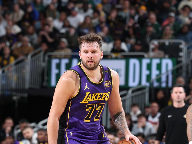 MILWAUKEE, WI - MARCH 13: Luka Doncic #77 of the Los Angeles Lakers drives to the basket during the game against the Milwaukee Bucks on March 13, 2025 at Fiserv Forum Center in Milwaukee, Wisconsin. NOTE TO USER: User expressly acknowledges and agrees that, by downloading and or using this Photograph, user is consenting to the terms and conditions of the Getty Images License Agreement. Mandatory Copyright Notice: Copyright 2025 NBAE (Photo by Jeff Haynes/NBAE via Getty Images).